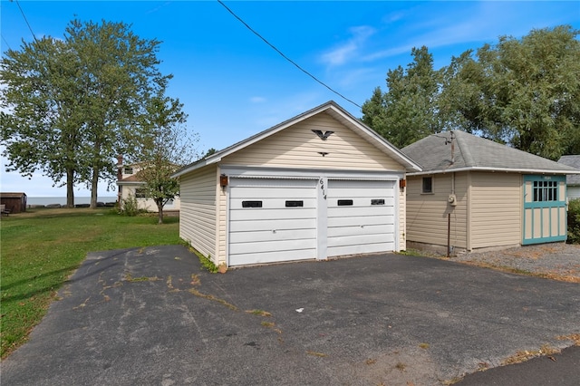 garage featuring a yard