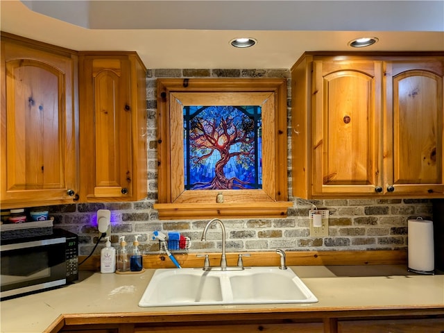 kitchen with sink and backsplash