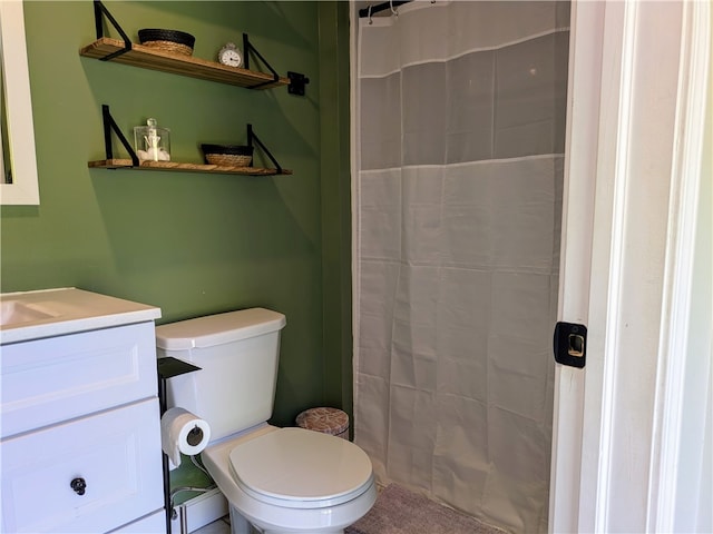 bathroom with vanity, toilet, and curtained shower