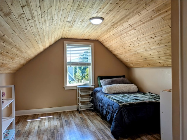 bedroom with wooden ceiling, vaulted ceiling, and hardwood / wood-style floors