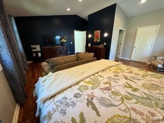 bedroom with lofted ceiling and hardwood / wood-style floors