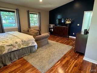 bedroom featuring dark hardwood / wood-style flooring