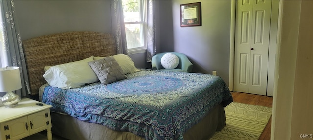 bedroom featuring light hardwood / wood-style flooring and a closet