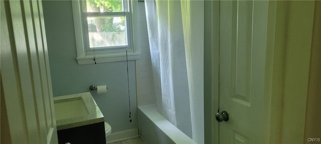 full bathroom with vanity, toilet, and shower / tub combo