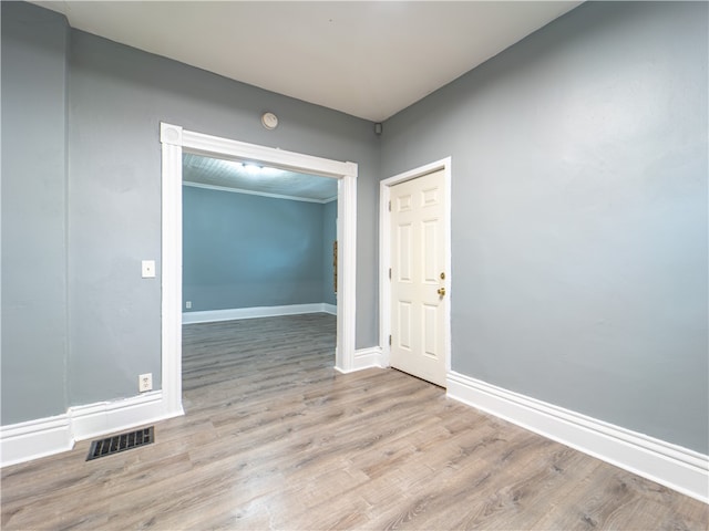 unfurnished room with light hardwood / wood-style floors