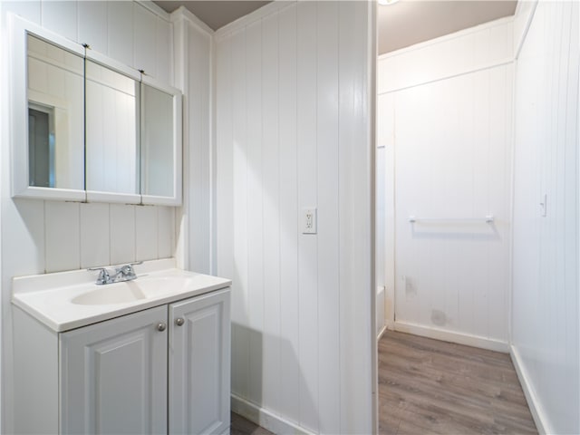 bathroom with vanity and hardwood / wood-style flooring