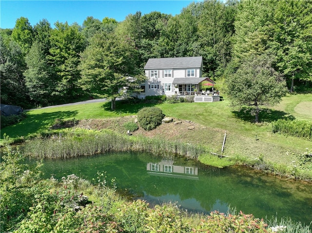 birds eye view of property with a water view