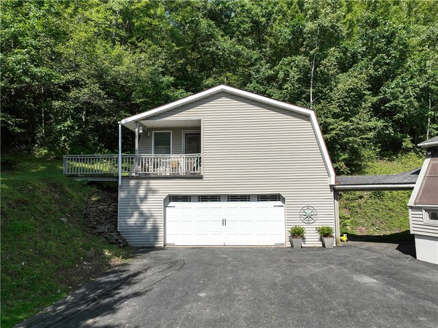 view of side of home featuring a garage