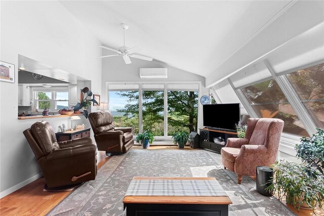 sunroom / solarium with an AC wall unit, lofted ceiling, and ceiling fan