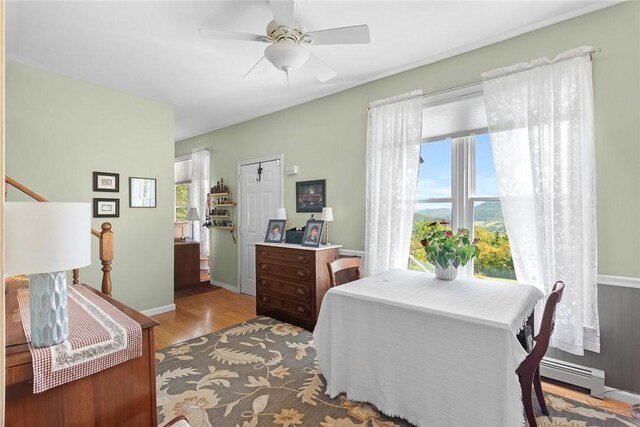 bedroom featuring a closet, light hardwood / wood-style floors, and ceiling fan