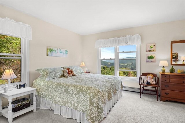 carpeted bedroom with a baseboard radiator