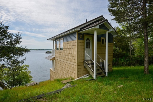 view of outbuilding with a water view