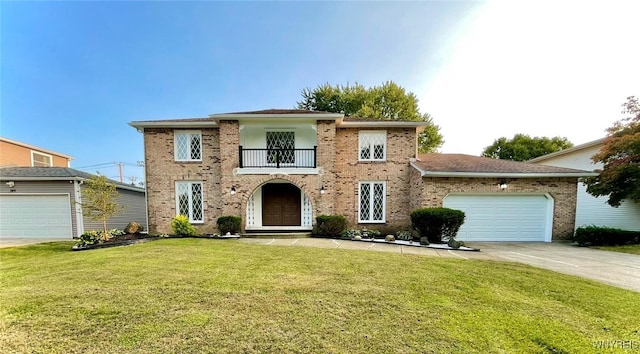 view of front facade with a balcony, a garage, and a front lawn