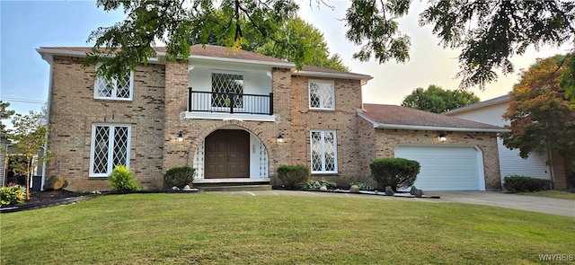 view of front of house with a balcony, a garage, and a yard