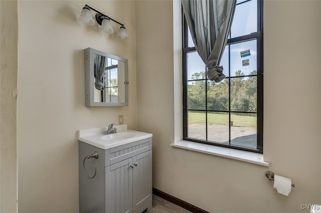 bathroom with plenty of natural light and vanity