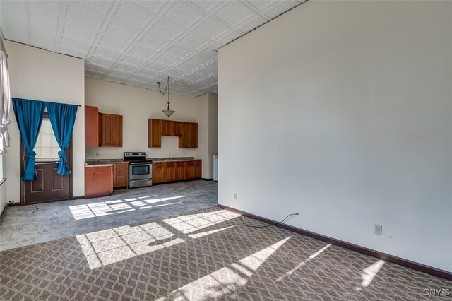 unfurnished living room featuring sink