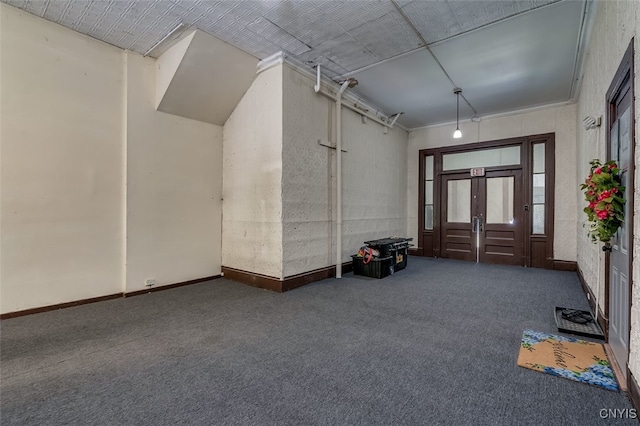 view of carpeted entrance foyer