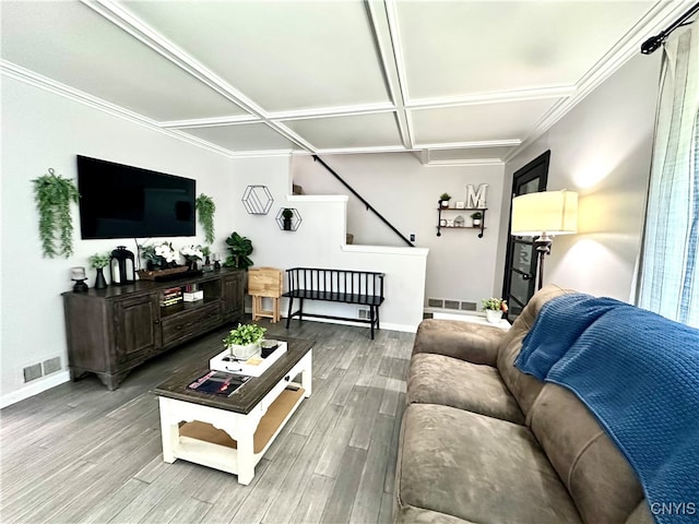 living room with hardwood / wood-style floors, coffered ceiling, and ornamental molding