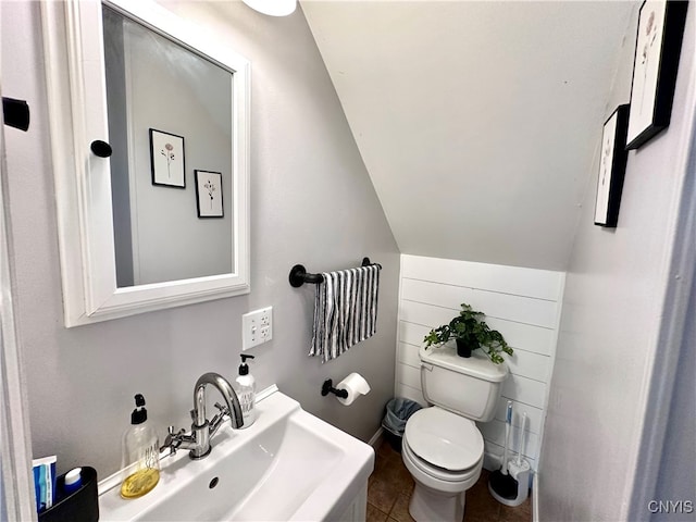 bathroom featuring tile patterned flooring, toilet, and sink