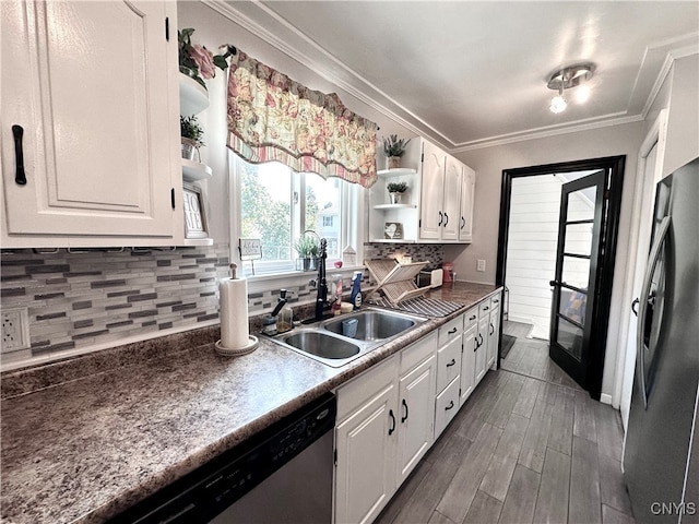 kitchen with dark wood-type flooring, stainless steel appliances, and white cabinetry