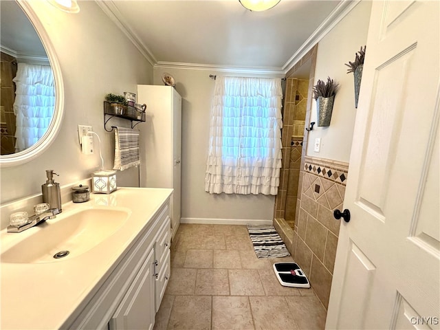 bathroom with a shower, crown molding, and vanity