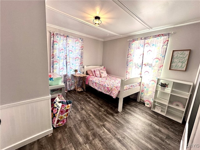 bedroom featuring ornamental molding and dark wood-type flooring