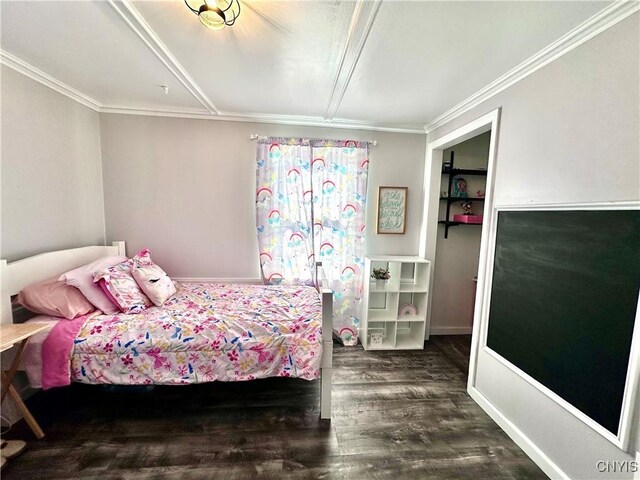 bedroom with dark wood-type flooring and ornamental molding