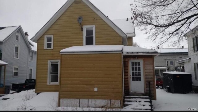 view of snow covered house