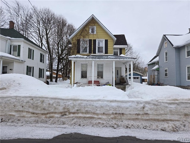 view of front of house featuring a garage and a porch