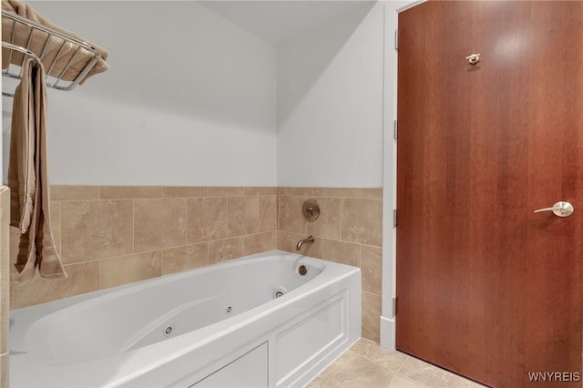 bathroom featuring tile patterned flooring and a bathtub