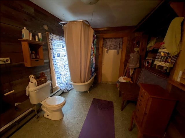 full bathroom with a shower with curtain, a bathtub, a baseboard radiator, toilet, and wooden walls