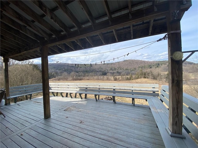 wooden deck with a mountain view
