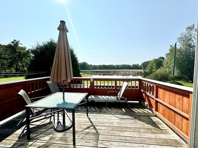 wooden deck featuring a water view