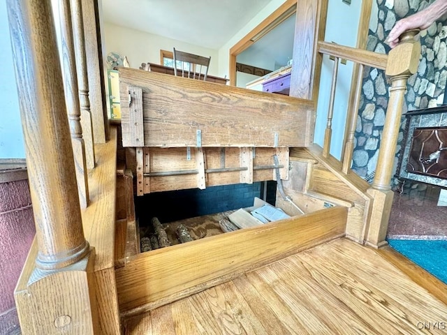 staircase with hardwood / wood-style floors