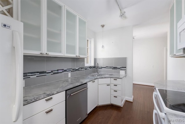 kitchen featuring sink, pendant lighting, white cabinetry, light stone counters, and white appliances