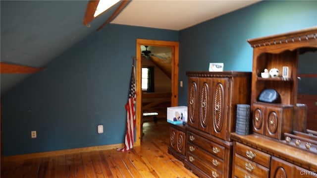 bonus room featuring lofted ceiling and wood-type flooring