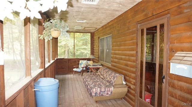 sunroom featuring wood ceiling