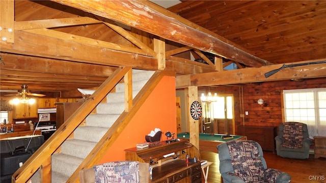 interior space with ceiling fan, hardwood / wood-style floors, wooden walls, and wooden ceiling