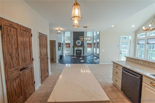 kitchen with dishwasher, a center island, and a healthy amount of sunlight