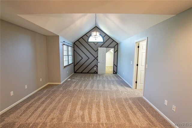 bonus room featuring vaulted ceiling and carpet flooring