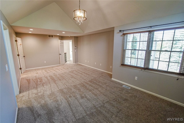 unfurnished room featuring carpet, an inviting chandelier, and high vaulted ceiling