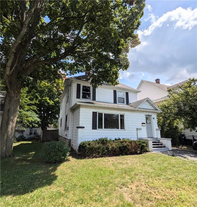 front facade featuring a front lawn