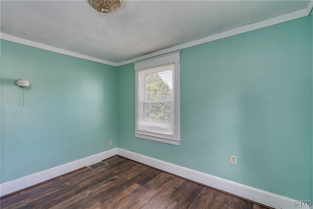 unfurnished room with dark hardwood / wood-style flooring and crown molding