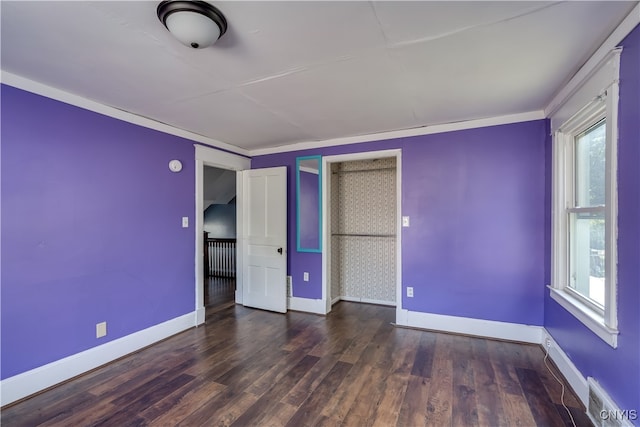 unfurnished bedroom featuring dark hardwood / wood-style floors and a closet