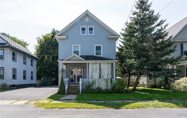 front facade featuring a front yard and a porch