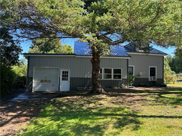 exterior space featuring a lawn and a garage