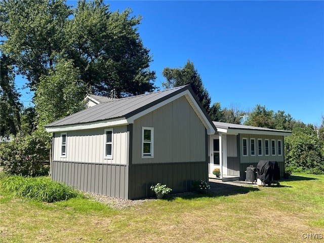 view of home's exterior featuring a lawn