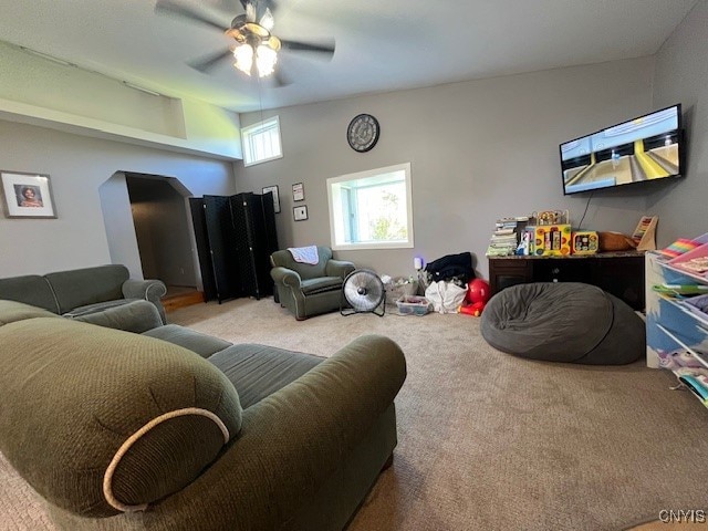 living room with light carpet and ceiling fan