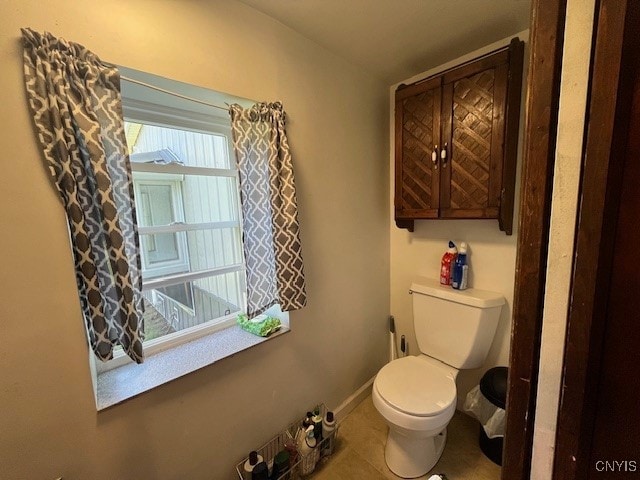 bathroom featuring tile patterned floors and toilet