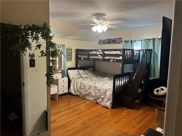 bedroom with ceiling fan and hardwood / wood-style flooring